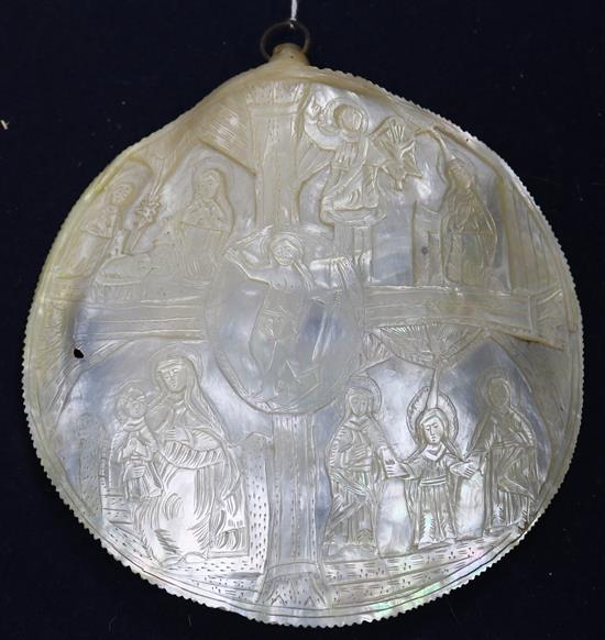 An oyster shell carved with The Nativity
